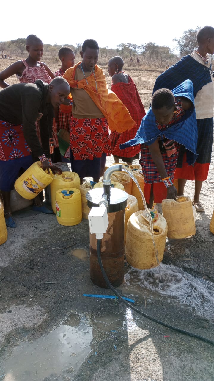 Clean potable water flowing from the completed solar borehole wellhead